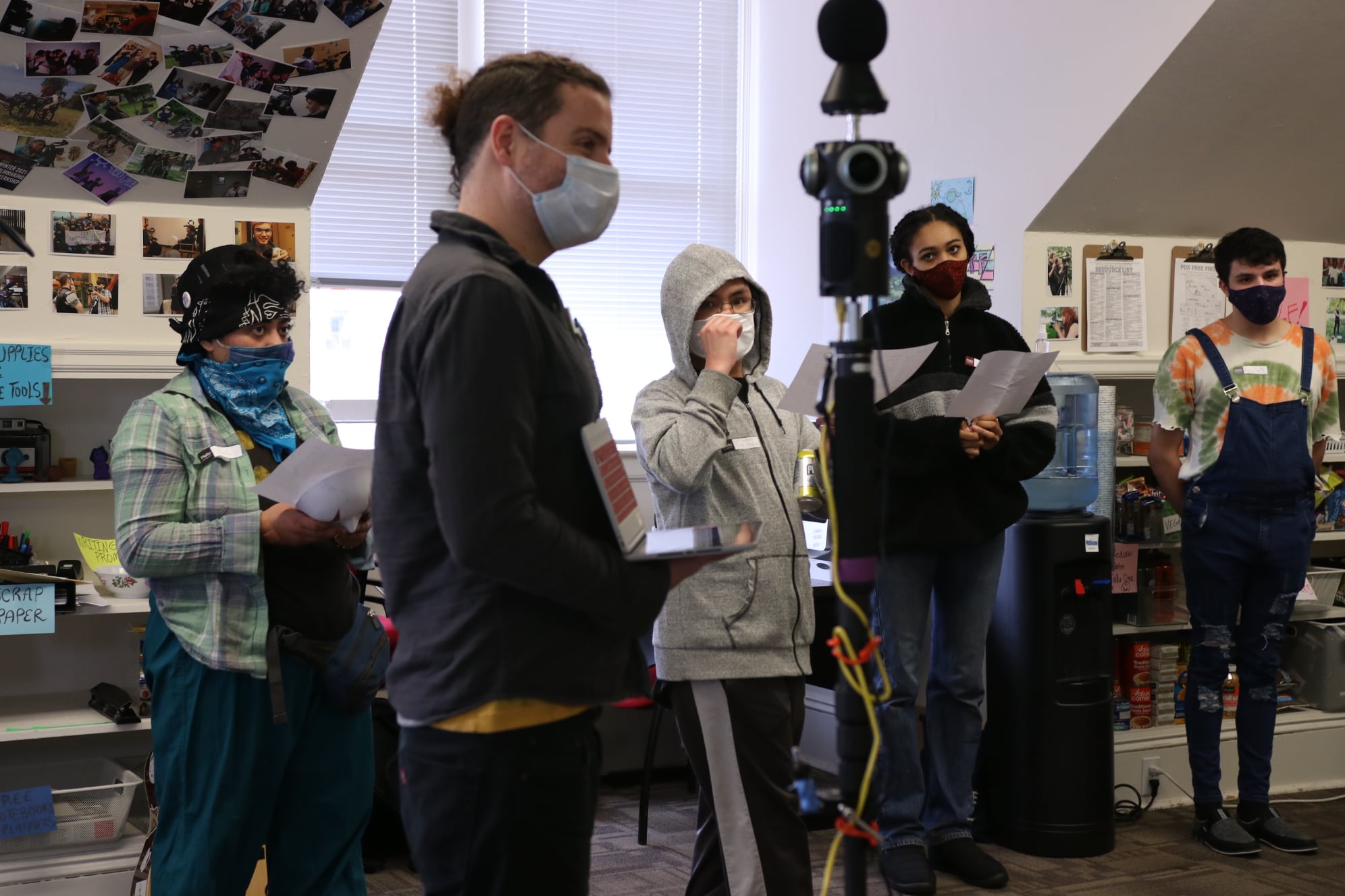 Concert videographer filming music performance with professional camera equipment